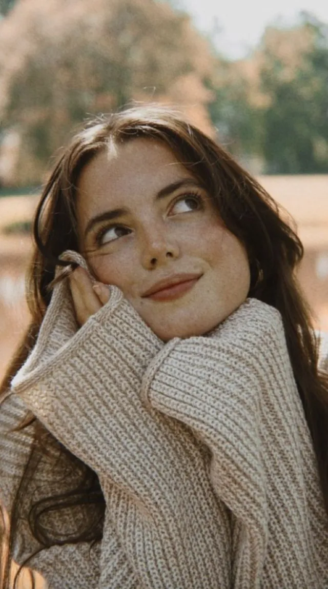 Portrait photo of a woman in a sweater before Image to Sketch conversion